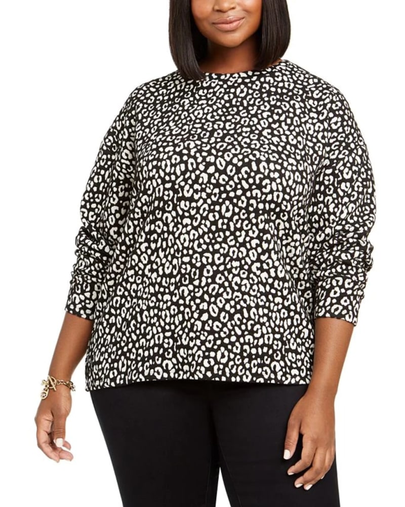 Front of a model wearing a size 0X Michael Kors Women's Plus Animal Print Jacquard Top Black Size 0X in Black by Michael Kors. | dia_product_style_image_id:311384